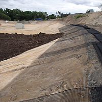 Geogrid installation using the wrap around technique