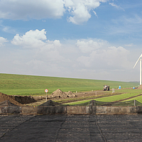 Earth reinforced with geogrids as a crane pad for wind turbine construction